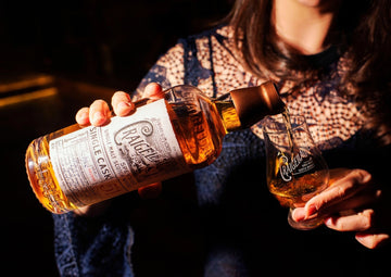 A bottle of Craigellachie 51 being poured into a glass 