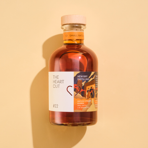 New Riff bourbon whiskey cask 22 bottle on beige background with shadow
