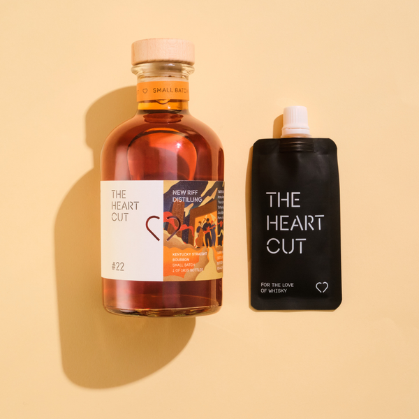 Bottle of #22 New Riff whiskey next to a Pocket Pour