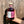 Bottle of 'The Heart Cut' whisky held in front of a wooden background

