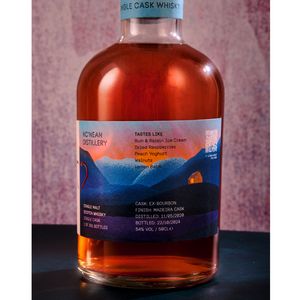 Nc'nean organic Scottish whisky bottle on neutral background studio shot
